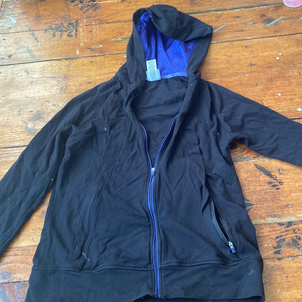 I am selling a thin black and blue zip up hoodie